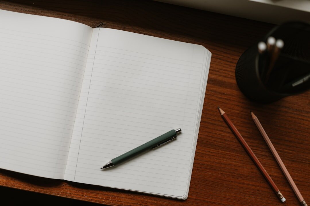 writer at desk with notebook